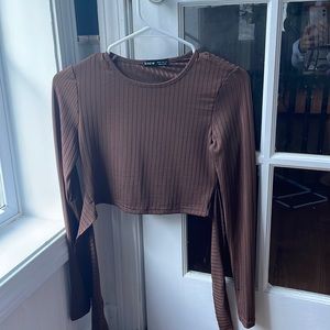 worn before, ties in the back, long sleeve